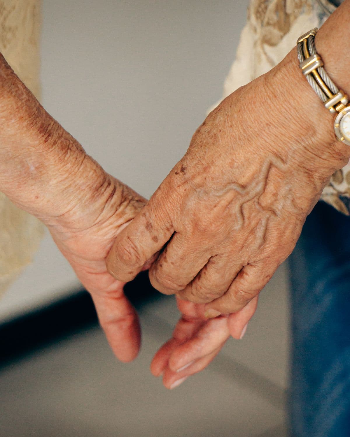 Holding hands — calm, familiar reassurance