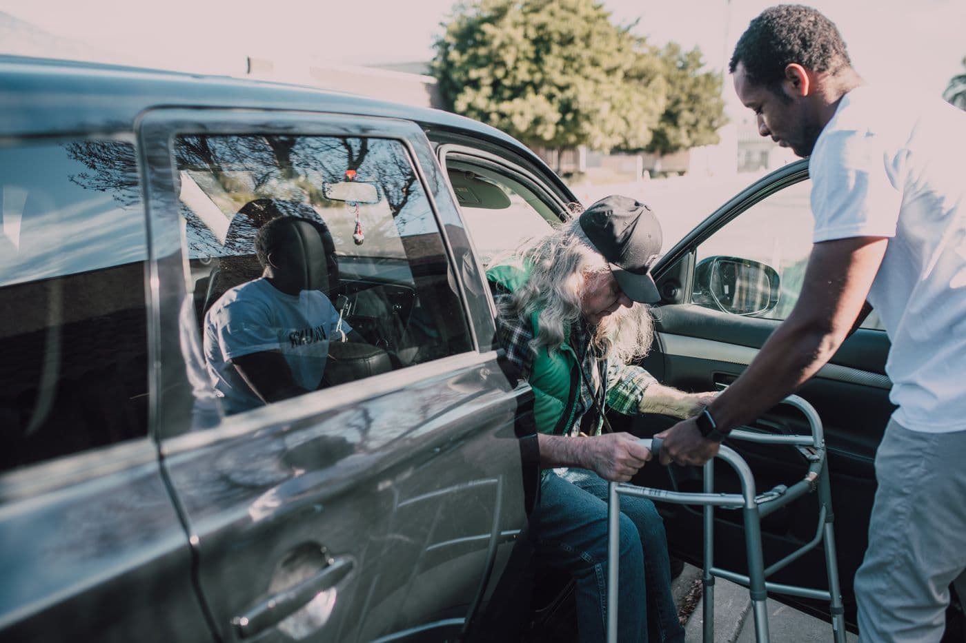 A carer helping a client move safely