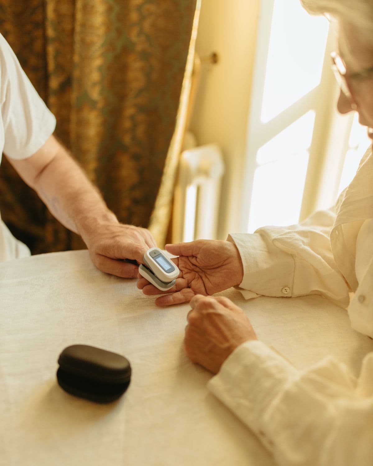 A carer checking a client's wellbeing at home